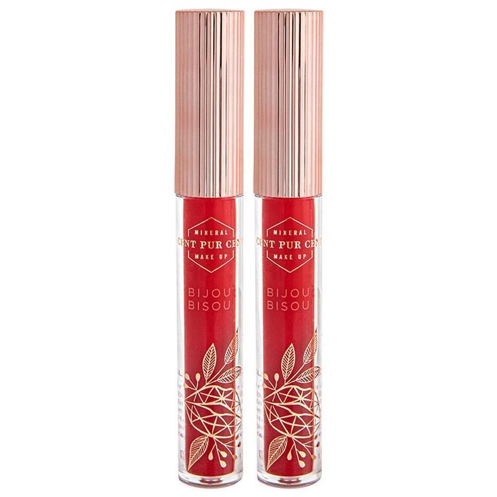 Twee rode lipglossen met gouden versieringen en roségouden doppen.