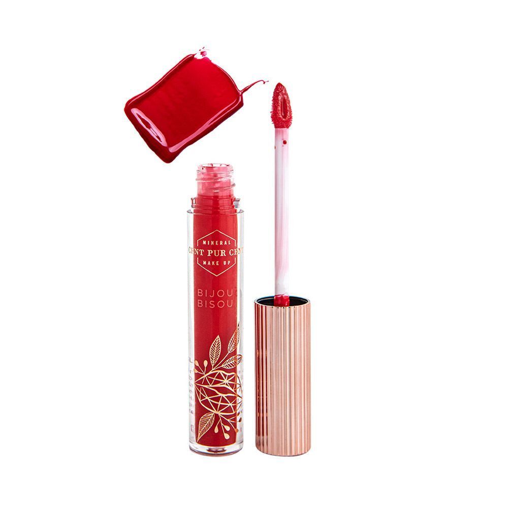 Un gloss à lèvres rouge avec applicateur et une goutte de couleur rouge à côté.