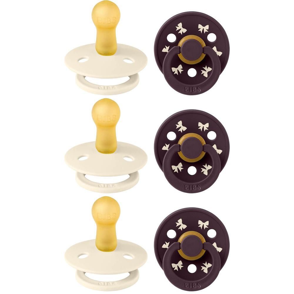 Trois sucettes BIBS crème et trois violet foncé, tétine ronde en latex avec motif nœuds.