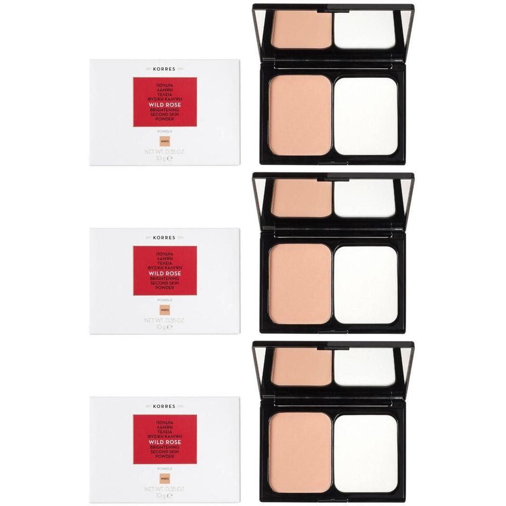 Trois boîtiers compacts de poudre Korres Wild Rose avec applicateurs.