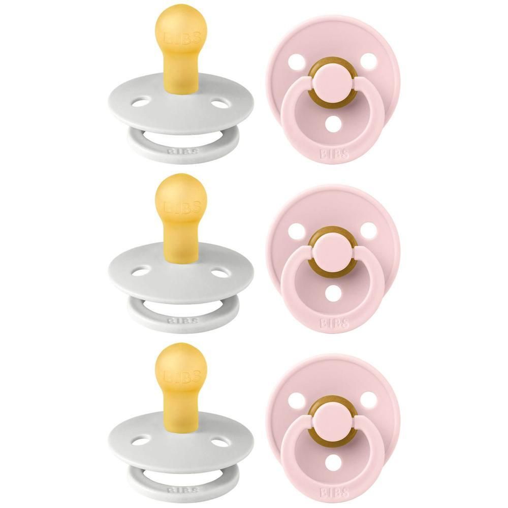 Deux sucettes BIBS : une grise et une rose, toutes deux avec tétine jaune et bouclier blanc.