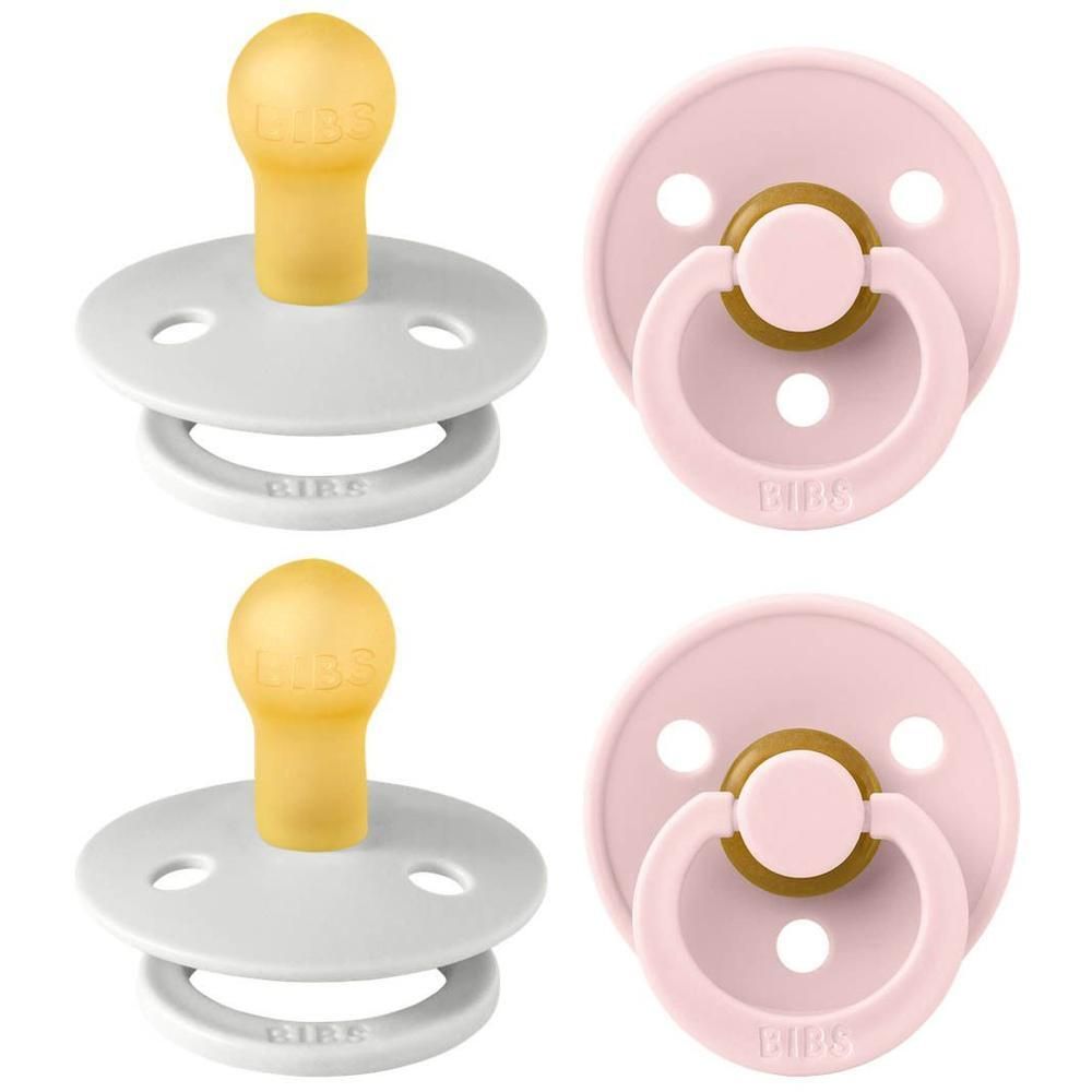 Deux suces BIBS : un gris et un rose, tous deux avec tétine en caoutchouc naturel jaune et poignée blanche.