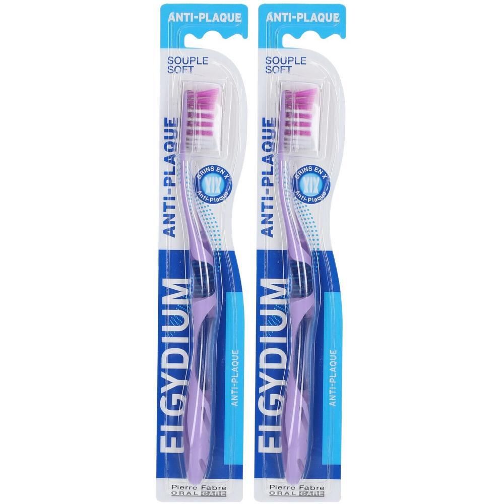 Deux brosses à dents Elgydium Anti-Plaque, souples, violettes avec poils roses.