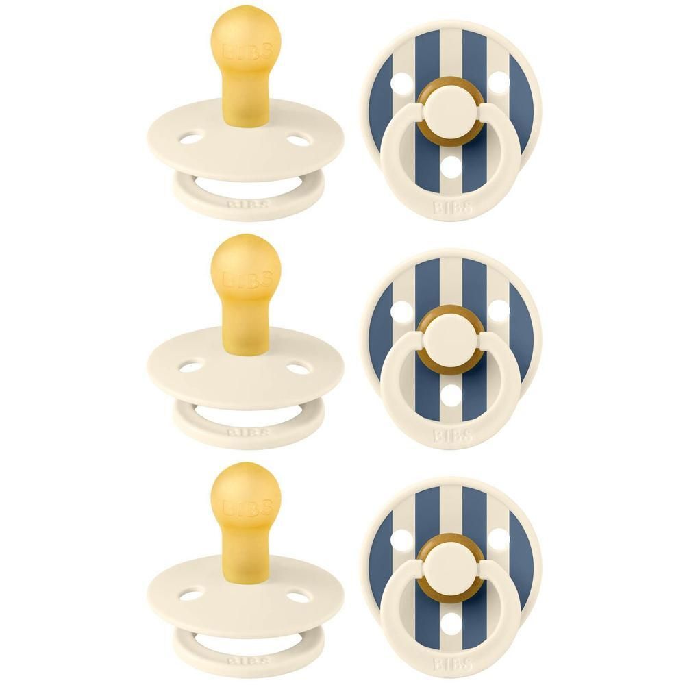 Twee crème kleurige fopspenen met gele speen en twee gestreifte spenen met witte ring en gouden knop.