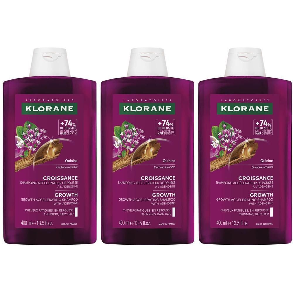 Trois flacons de shampoing Klorane Croissance, étiquette violette, bouchon blanc.