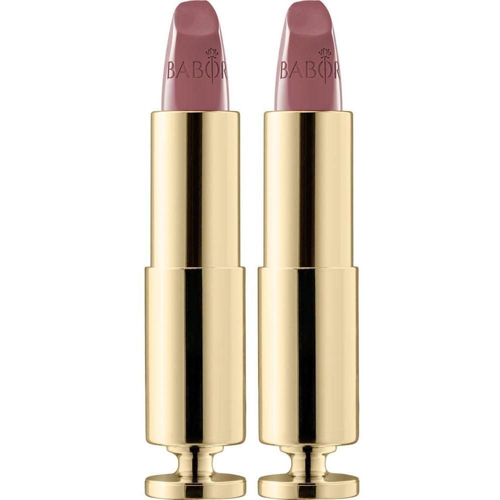 Deux tubes de rouge à lèvres dorés avec un rouge à lèvres Nude Pink.