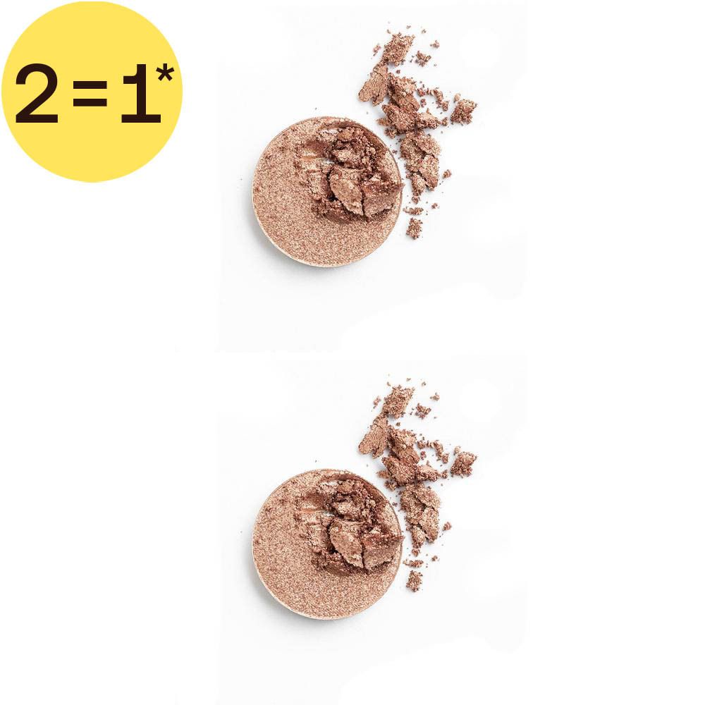Un fard à paupières rond, couleur bronze métallique, avec des morceaux ébréchés.