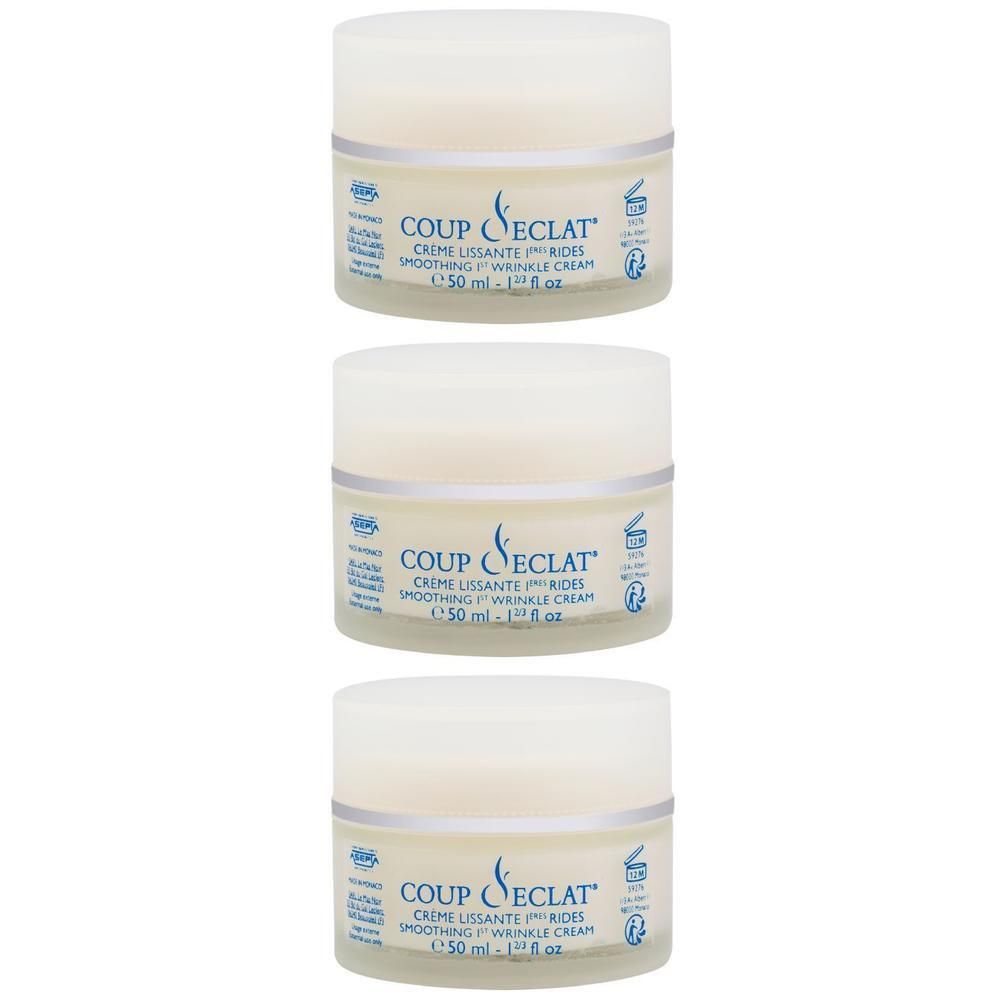 Trois pots de crème avec inscriptions.