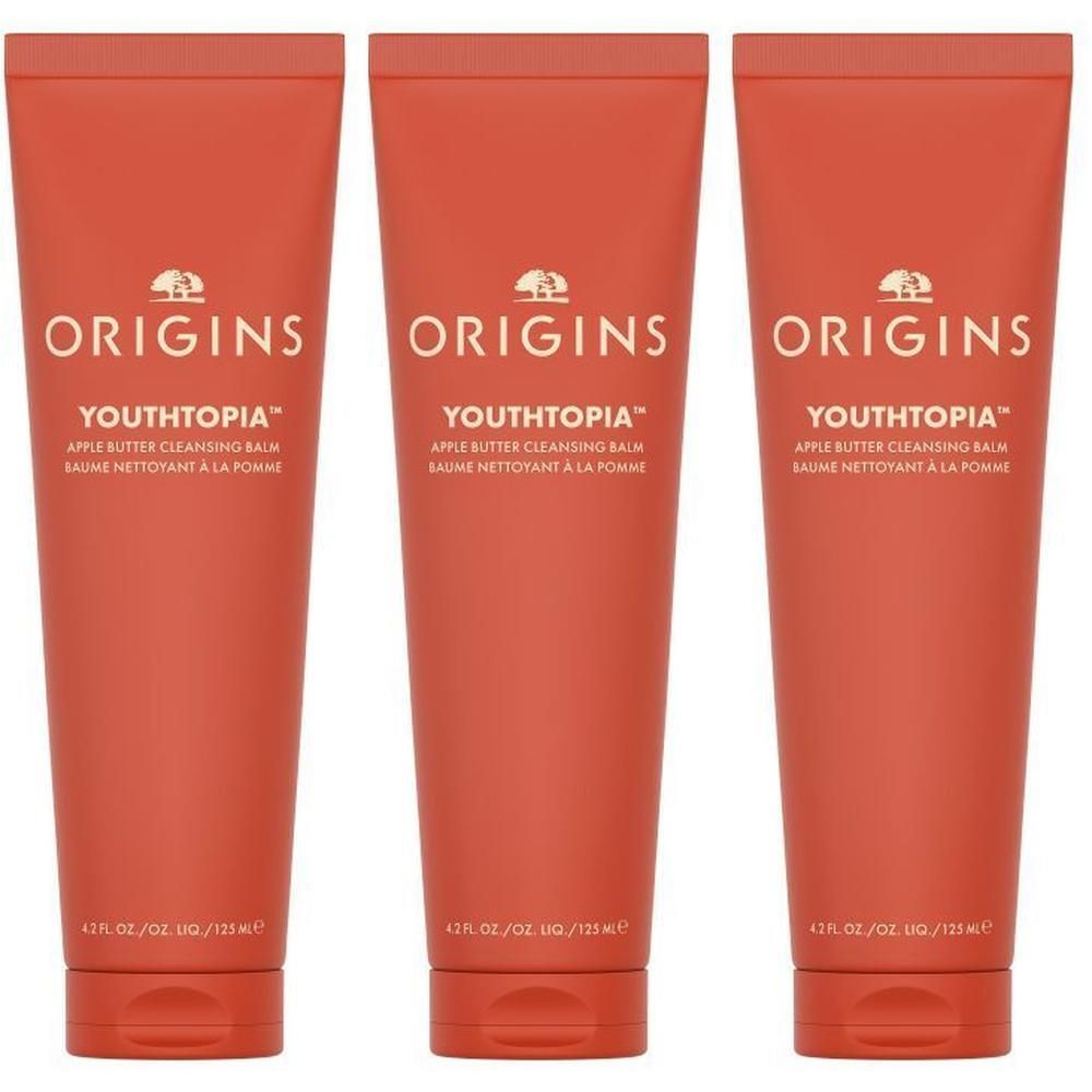 Trois tubes de baume nettoyant au beurre de pomme Origins Youthtopia, couleur orange.