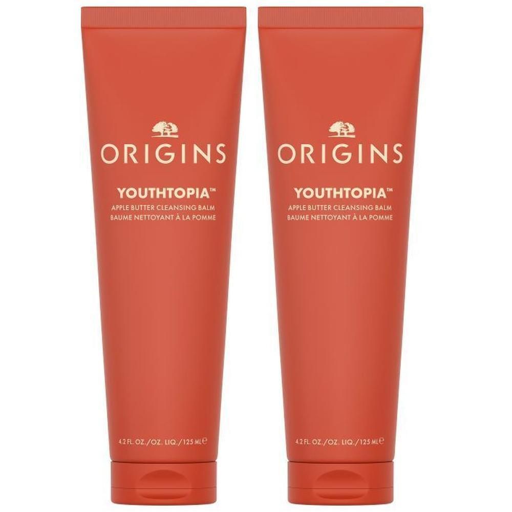Deux tubes de baume nettoyant au beurre de pomme Origins Youthtopia, couleur orange.