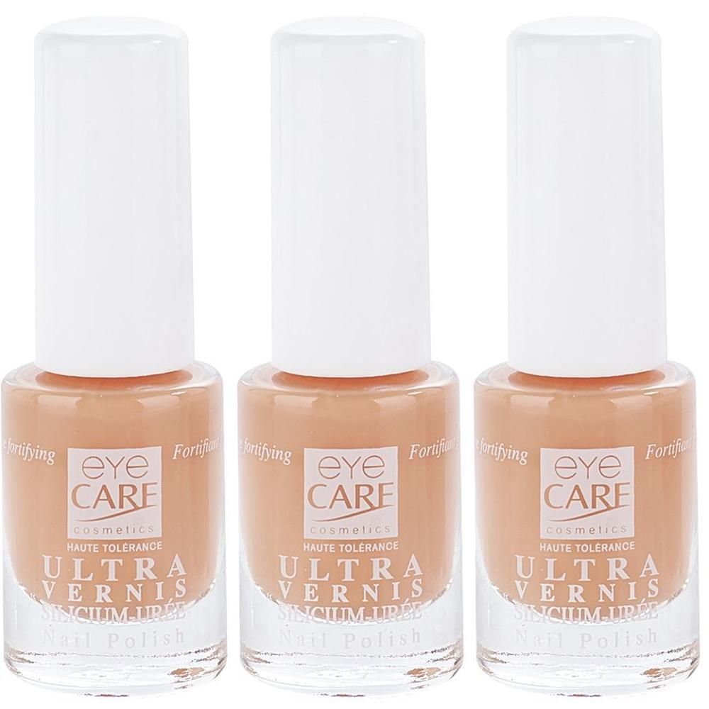 Trois flacons de vernis à ongles Eye Care Ultra Vernis couleur corail.