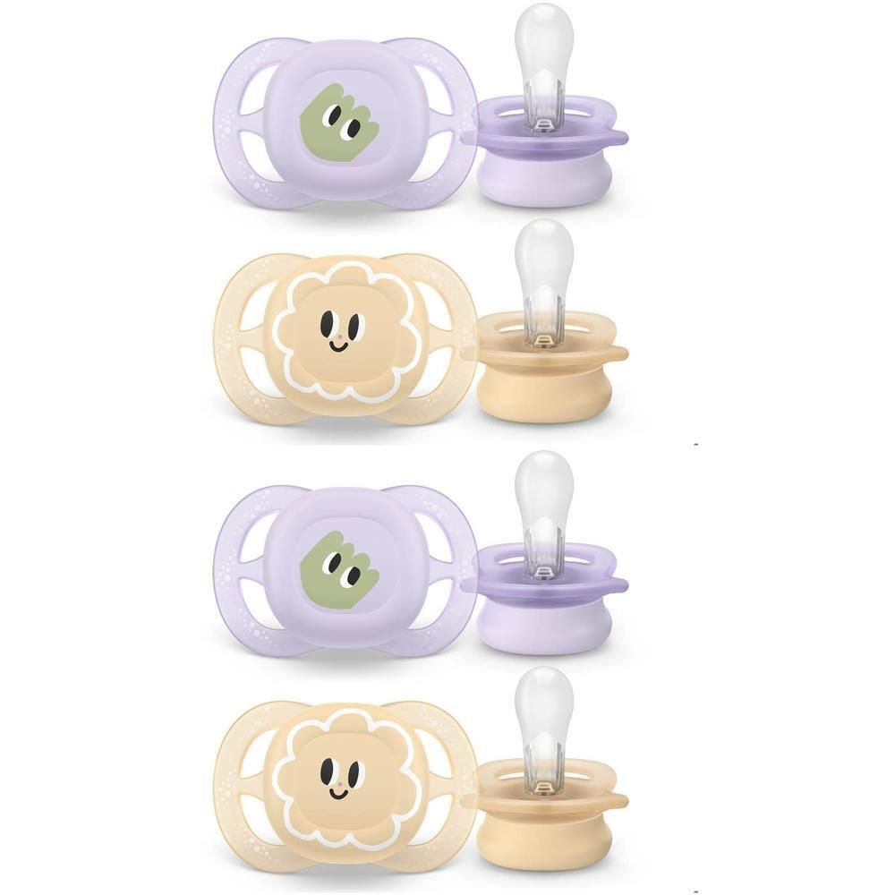 Quatre sucettes violettes et jaunes avec des motifs d'animaux.