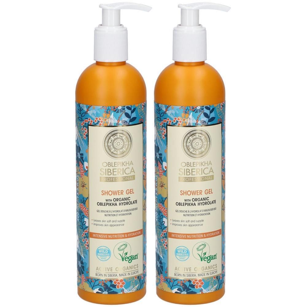 Deux flacons de gel douche avec pompe, bouchons orange, motifs floraux colorés.