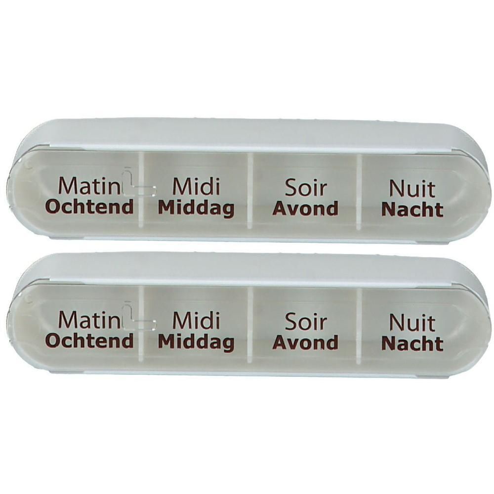 Deux piluliers blancs, chacun avec quatre compartiments pour matin, midi, soir et nuit.