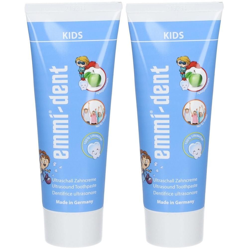 Deux tubes de dentifrice Emmi-Dent pour enfants. Emballage bleu clair avec illustrations enfantines.