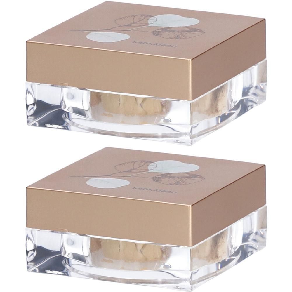 Deux contenants carrés à base transparente et couvercle doré avec motif floral.