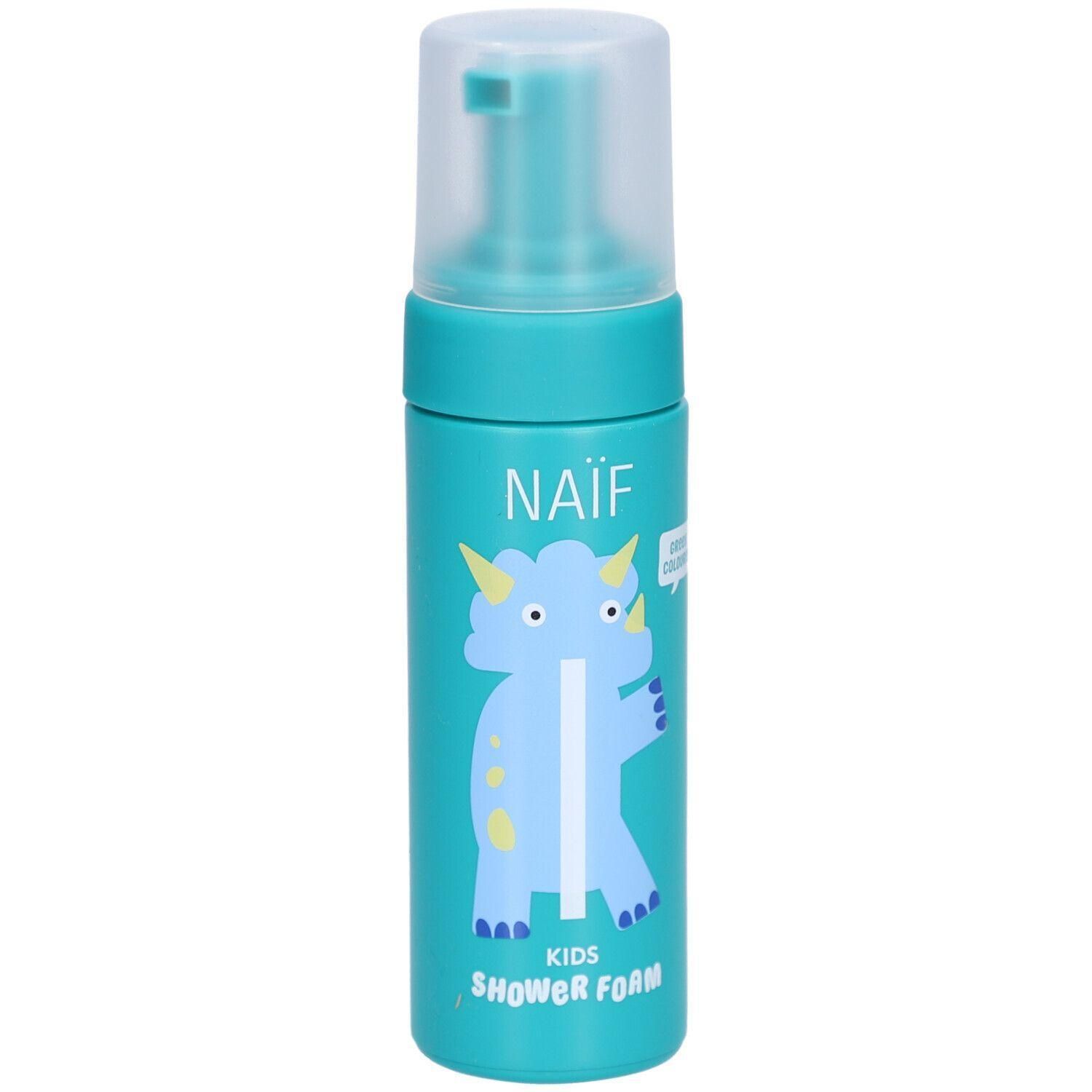 Turquoise fles met pompdosser, Naïf Kids Shower Foam, met blauwe dinosaurusprint.