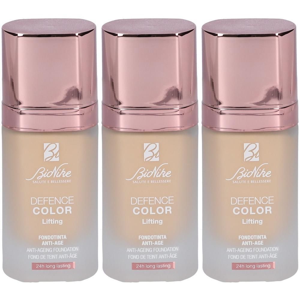 Trois fonds de teint BioNike Defence Color Lifting Ivoire. Flacons avec bouchons or rose.