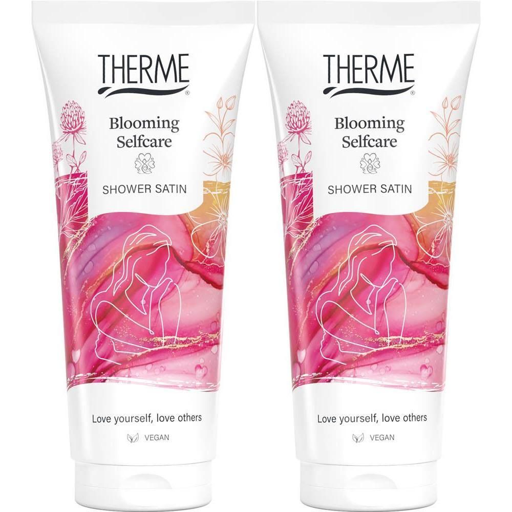 Twee tubes "Therme Blooming Selfcare Shower Satin" met bloemenprint.
