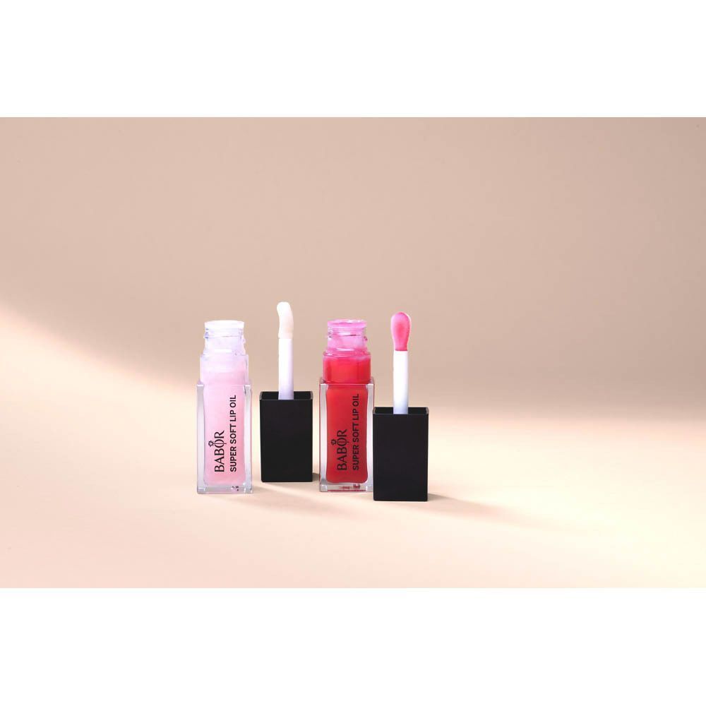 Deux huiles à lèvres Babor Super Soft Lip Oil, une teinte Juicy Red, avec applicateurs.