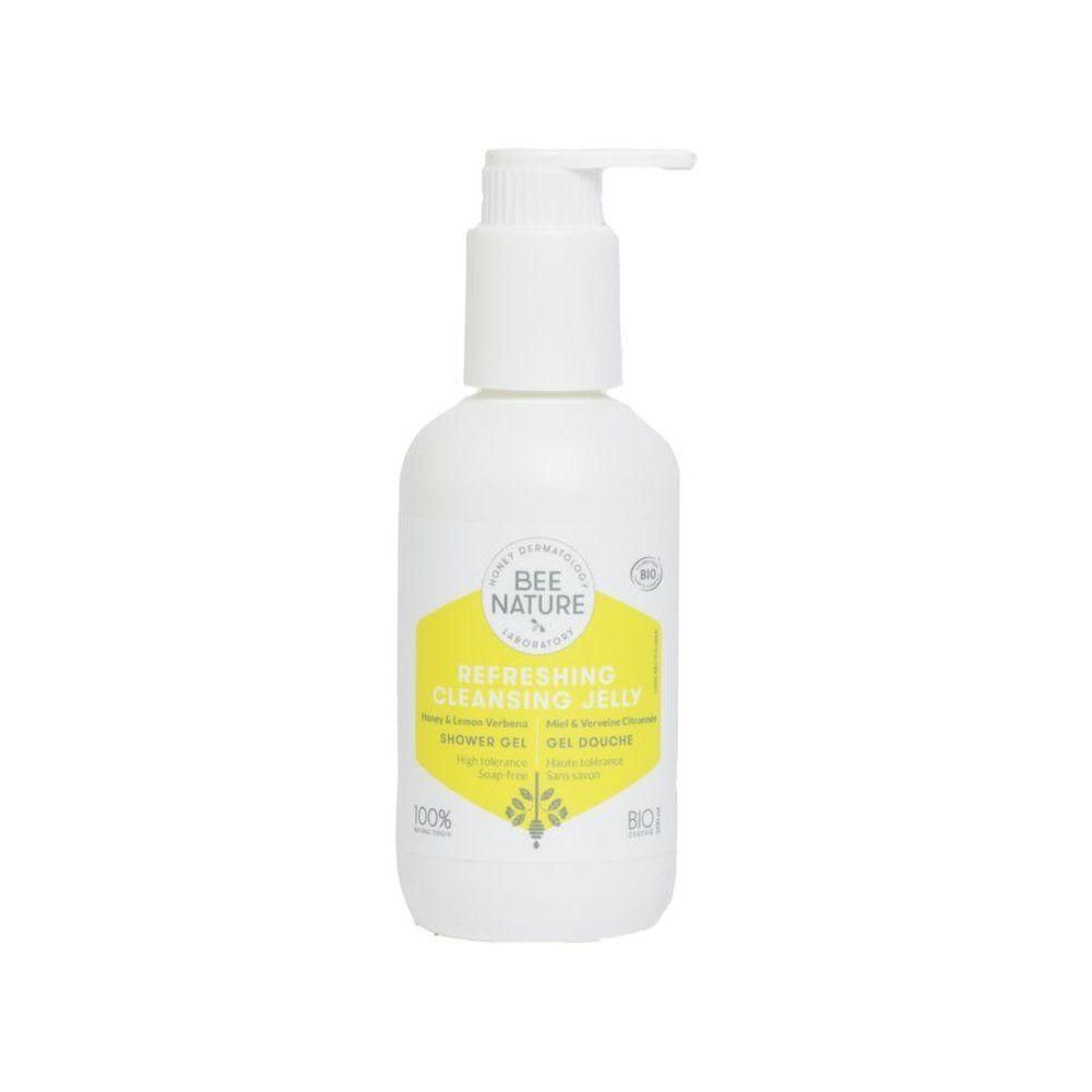 Flacon pompe blanc avec étiquette jaune pour gel douche.
