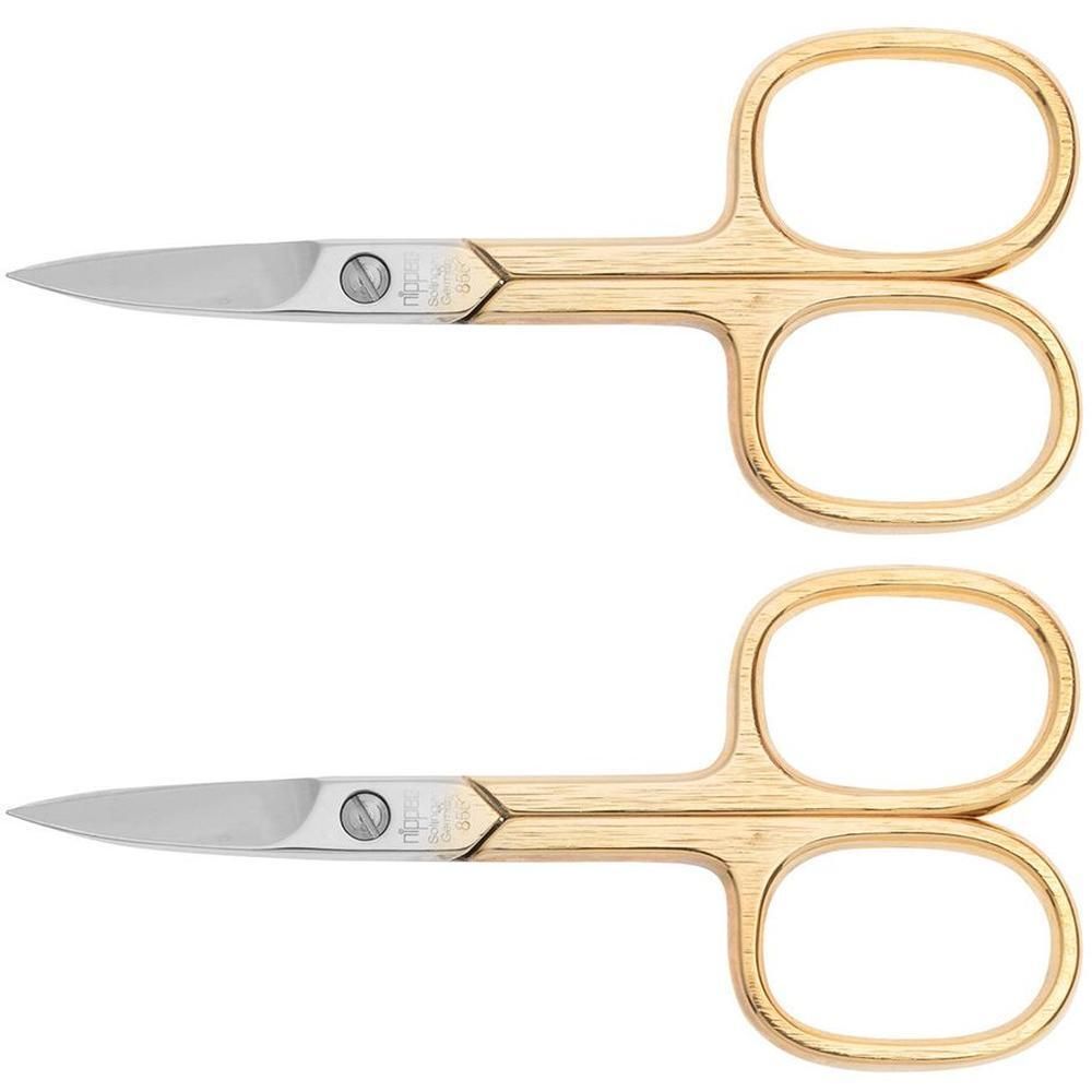 Twee gouden nagelschaartjes met zilveren bladen en gouden handvatten.