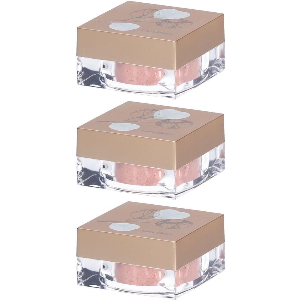 Trois petits pots de fard à paupières minéral en vrac, rose pâle. Contenants en acrylique transparent avec couvercles dorés et motif floral.