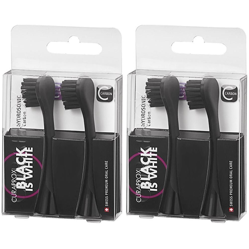 Twee pakken met elk twee zwarte Curaprox Hydrosonic Carbon opzetborstels.