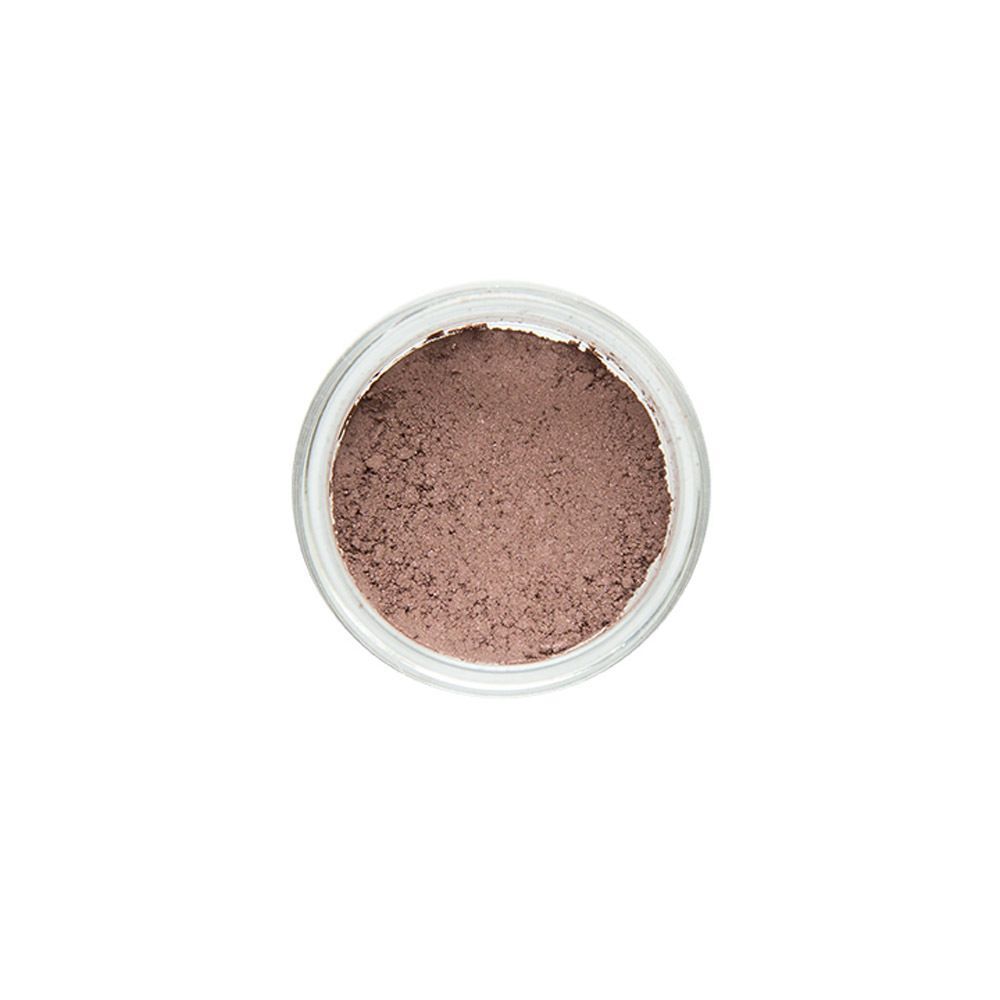 Vue de dessus d'un pot en verre ouvert avec couvercle rose doré, rempli de poudre minérale.