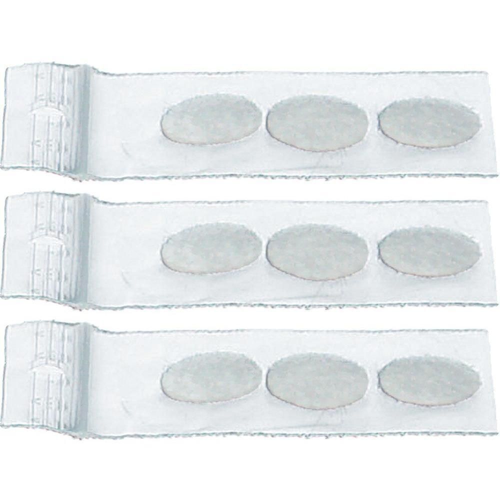 Trois filtres ovales gris sur un support transparent.