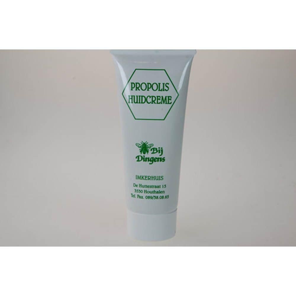 Tube blanche de crème pour la peau à la propolis. Texte et logo d'abeille verts.