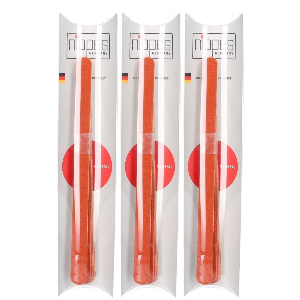Drie oranje nagelvijlen in individuele verpakking met "Nippes Germany" logo.