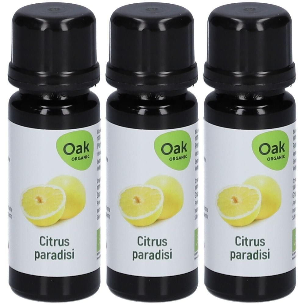 Drie flessen Oak Organic Citrus Paradisi etherische olie met grapefruitafbeelding en bio-keurmerk.