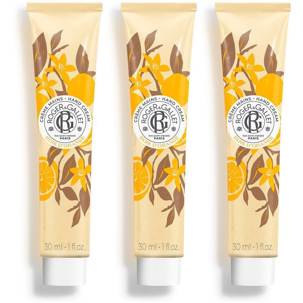 Drie tubes handcrème met oranjebloesem- en sinaasappelmotief. Elke tube toont de merknaam en 30 ml.