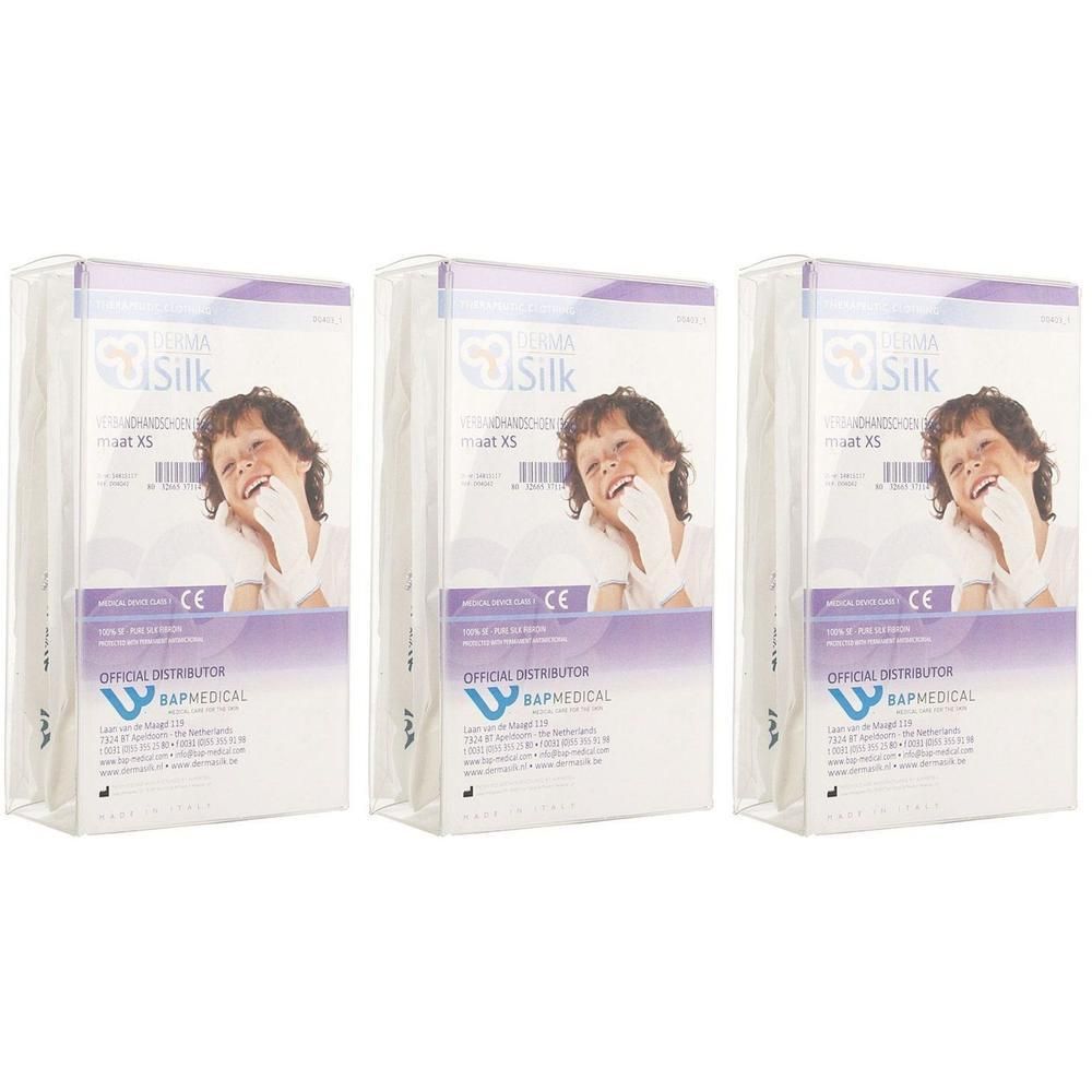 Trois paquets de gants de pansement Dermasilk XS avec marquage CE et informations fabricant.