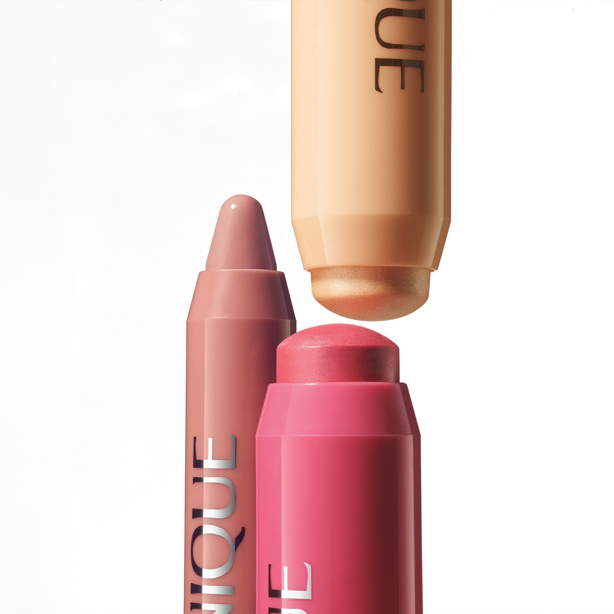 Close-up van roze en beige Clinique Chubby Sticks.