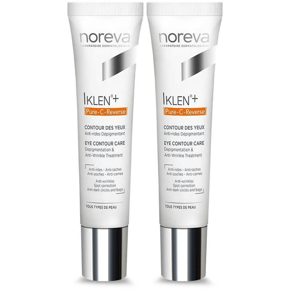 Twee Noreva Iklen+ Pure-C-Reverse oogcrème tubes met zilveren doppen.