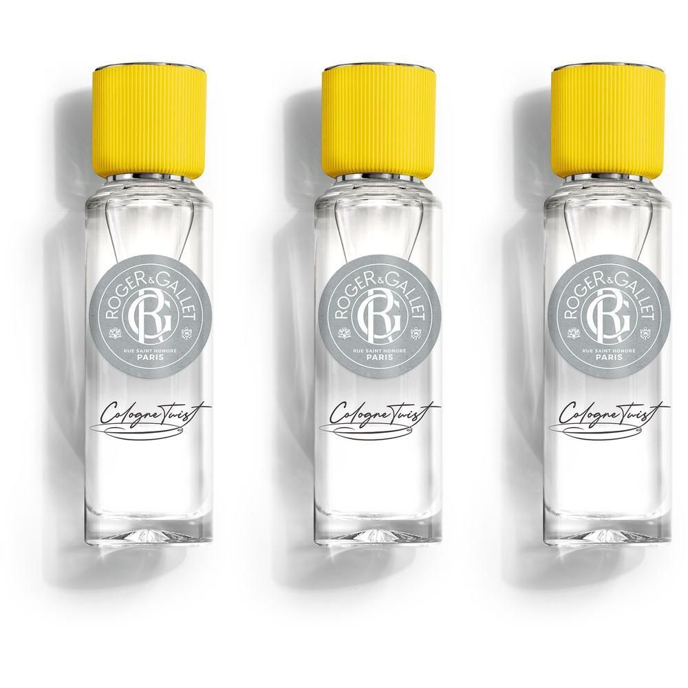 Trois flacons Roger & Gallet Twist Eau de Cologne avec bouchons jaunes sur fond blanc.