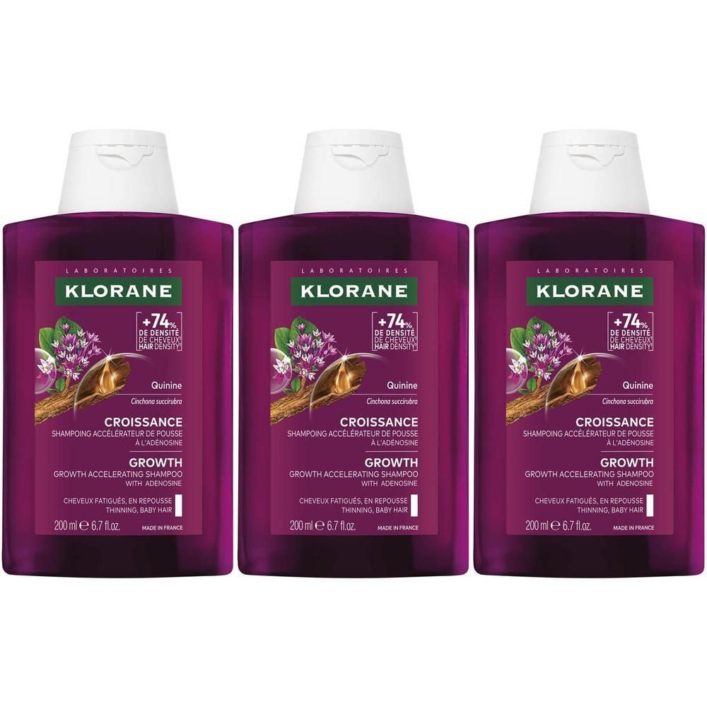 Drie Klorane flessen met paars etiket, met de shampoo voor haargroei.