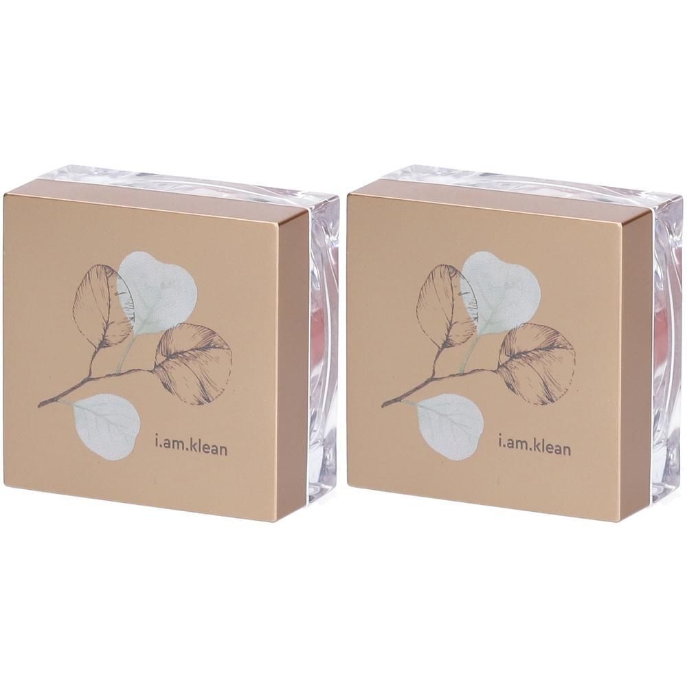 Twee i.am.klean loose mineral blush verpakkingen met bladerenmotief en gouden accent.