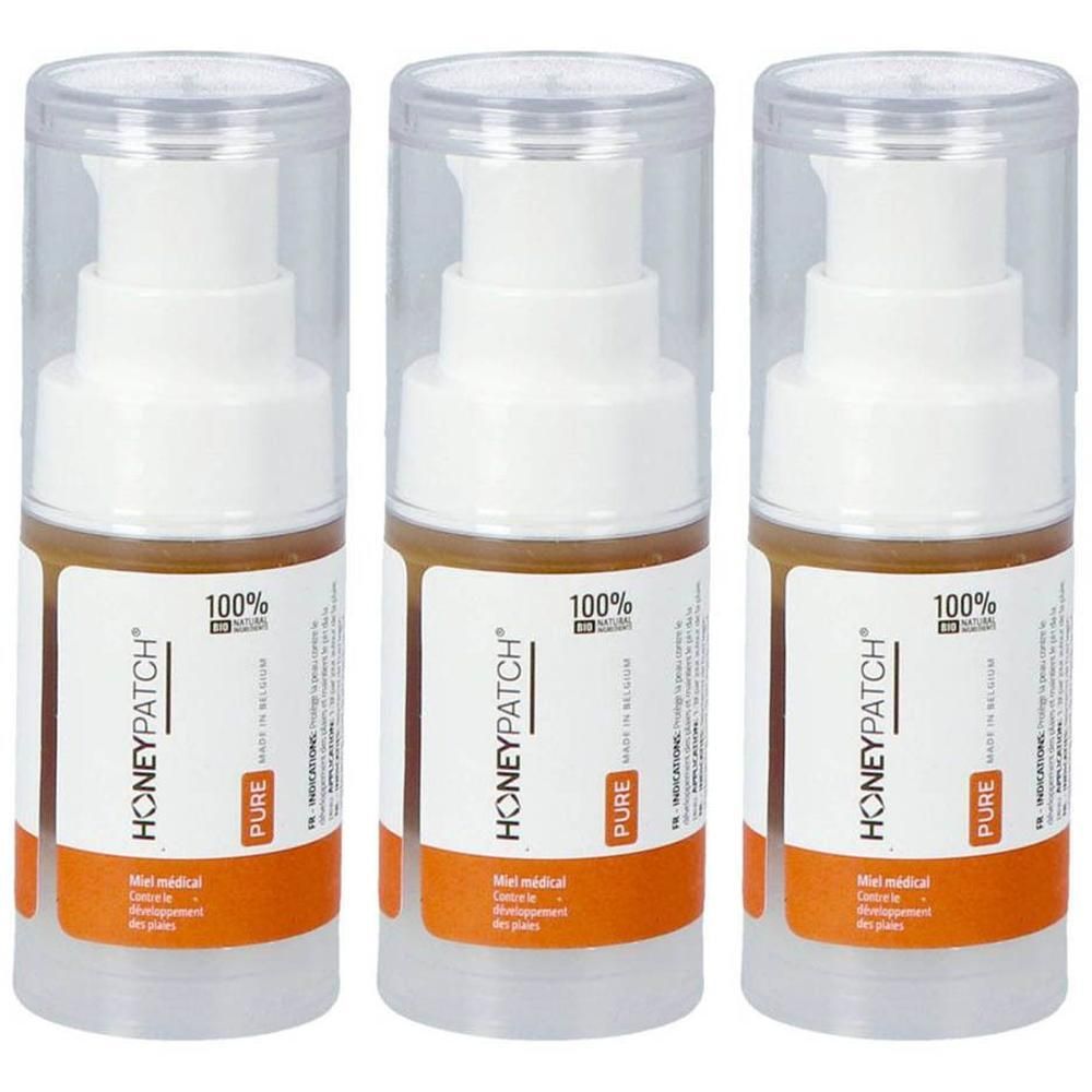 Drie flessen met Honey Patch pompdos. Transparante doppen en witte pompen boven bruine containers met oranje etiketten.