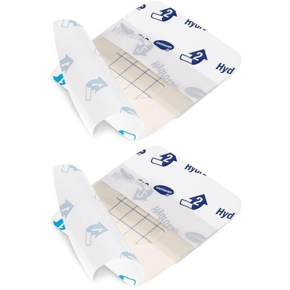 Twee Hartmann HydroTac compressen, transparant, steriel. Elke compress heeft een rasterpatroon.