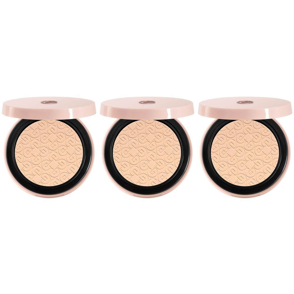 Trois boîtes de poudre compacte ouvertes avec motif en relief.
