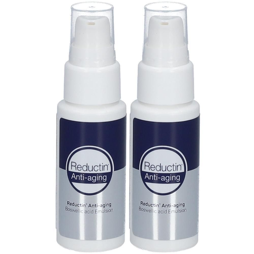 Twee witte pompflesjes met donkerblauw etiket. Tekst: Reductin Anti-aging, Boswellic acid Emulsion.