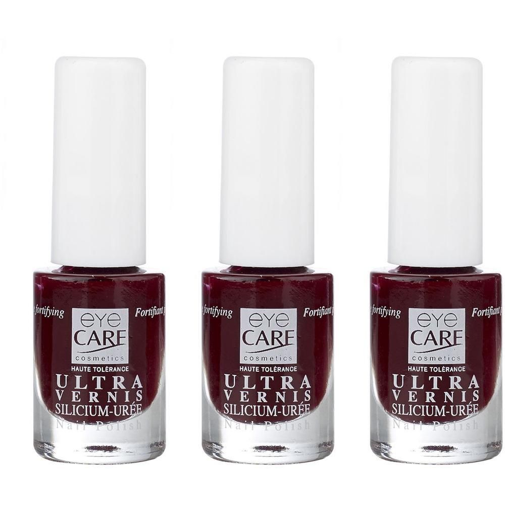 Drie flacons Eye Care Ultra Vernis Silicium-Uree nagellak in donkerrood.