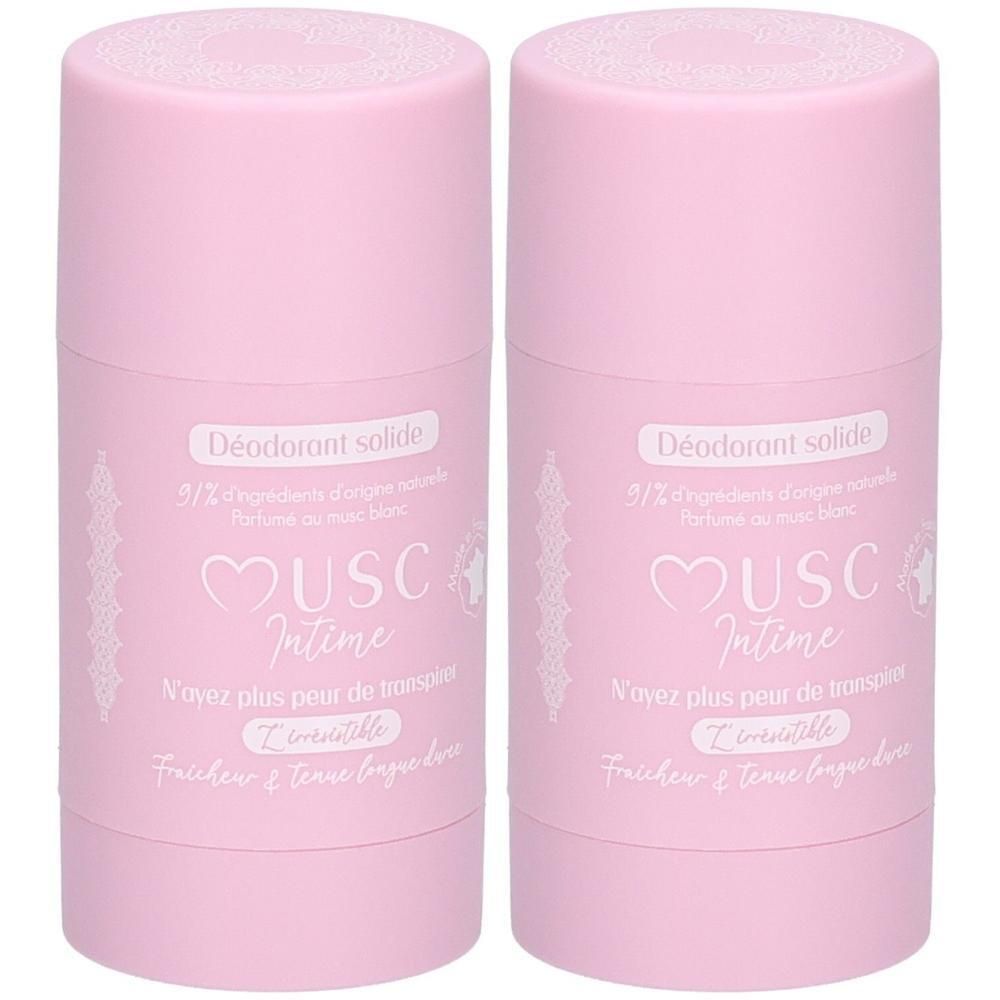 Twee roze deodorantsticks met witte belettering. "Déodorant solide" en "Musc Intime" zijn zichtbaar.