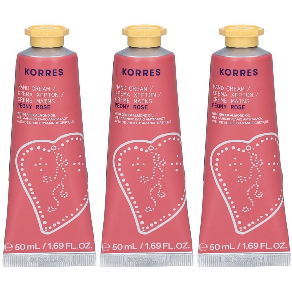 Drie Korres handcrème tubes in roze met gele doppen en hartmotief. 50 ml.