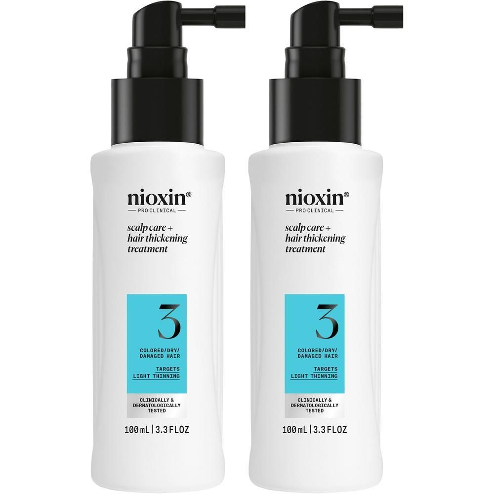 Twee Nioxin Systeem 3 flessen met pompdos voor hoofdhuid en haarverdikkingsbehandeling.