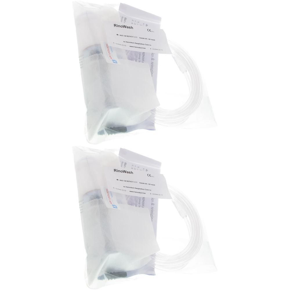Deux kits Rinowash Nasale Aerosol, chacun emballé dans un sac plastique, avec tuyaux et étiquettes.