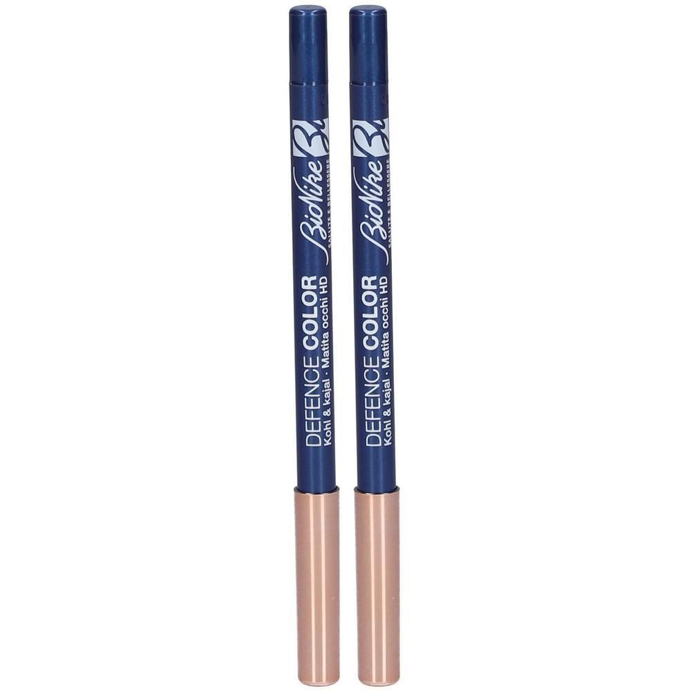 Twee marineblauwe kajalpotloden met gouden doppen. Tekst: BioNike Defence Color Kohl & Kajal HD.